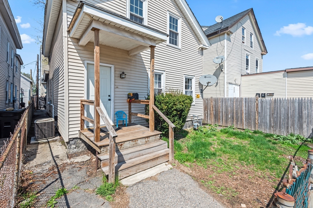549 Cambridge Street Worcester, MA 01610 - Photo 2 of 22 a view of a house with backyard and sitting area