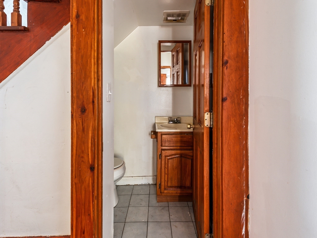 549 Cambridge Street Worcester, MA 01610 - Photo 4 of 22 view of room with hallway and wooden floor