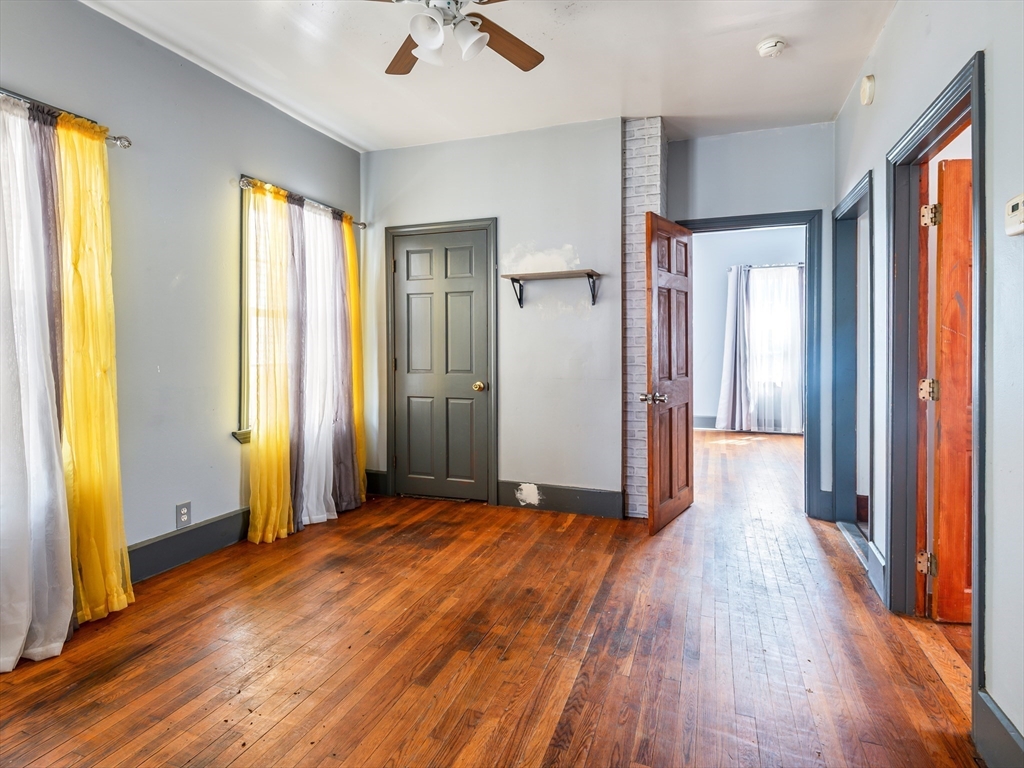549 Cambridge Street Worcester, MA 01610 - Photo 8 of 22 a view of livingroom with hardwood floor and a window