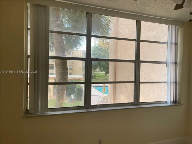 a view of a window in an empty room