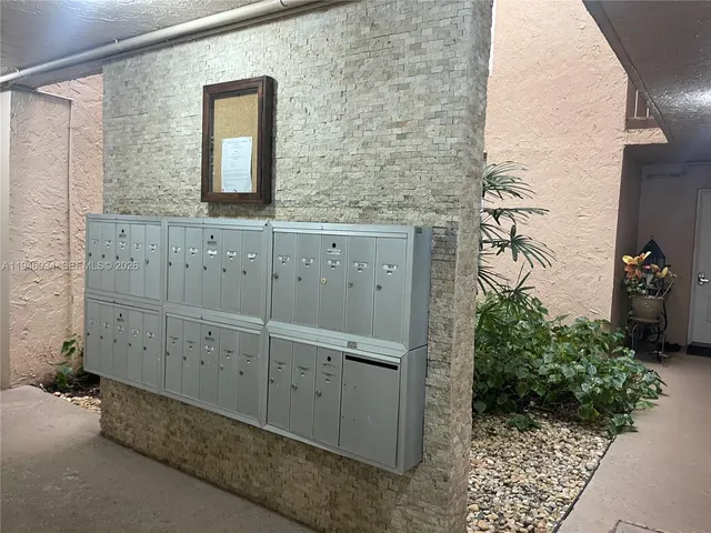 a bathroom with a shower and a mirror