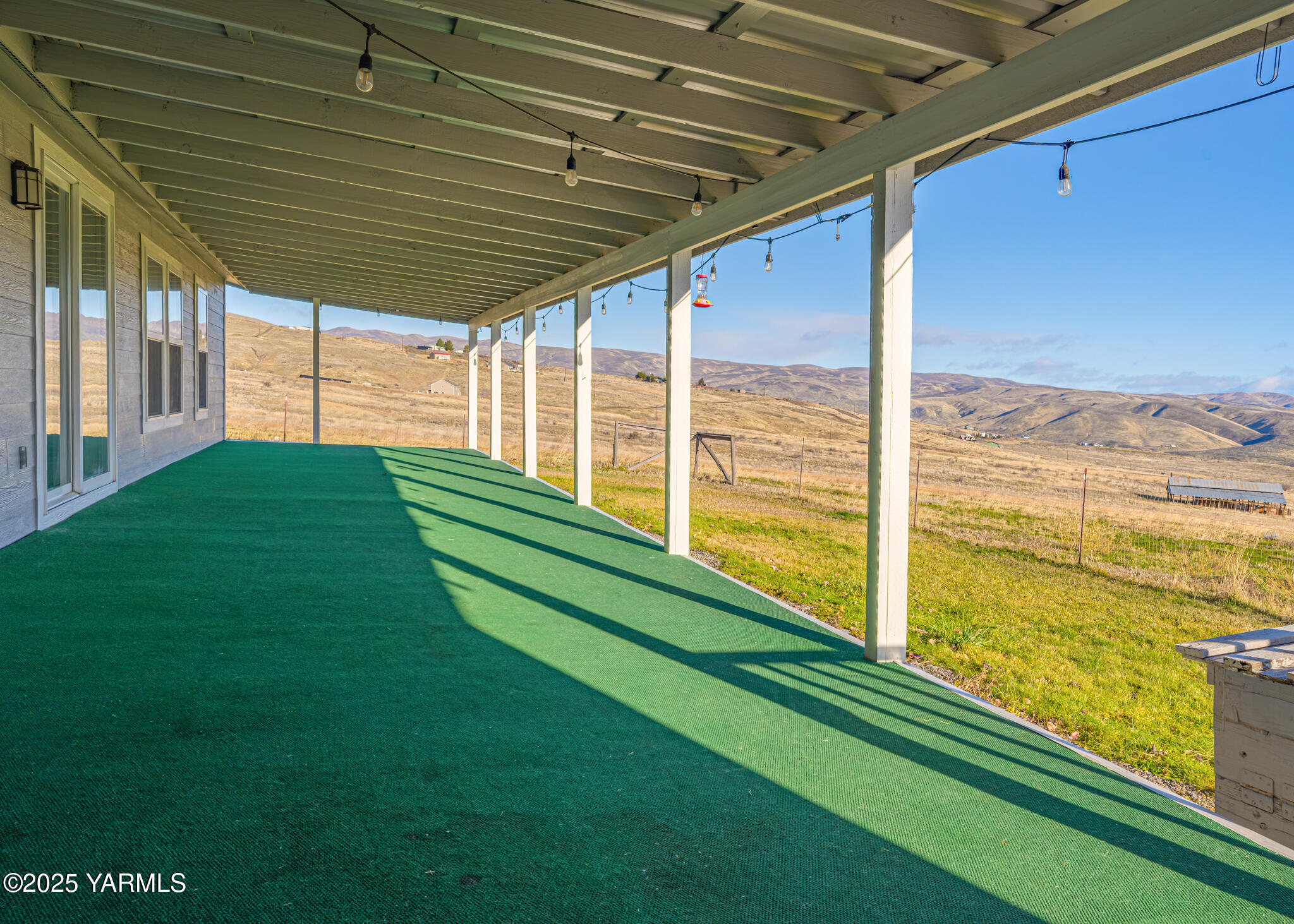 1421 Conrad Road Selah, WA 98942 - Photo 25 of 37 a view of a backyard with wooden floor and outdoor seating