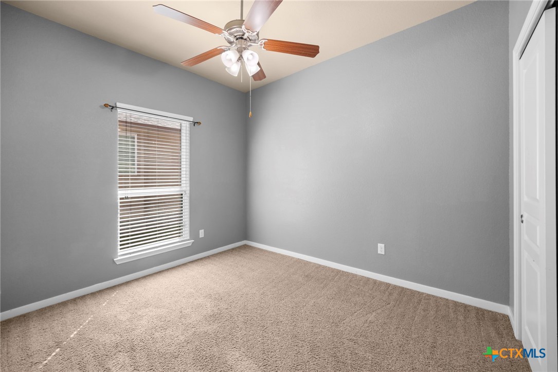517 Coventry Drive Temple, TX 76502 - Photo 15 of 34 an empty room with windows and fan