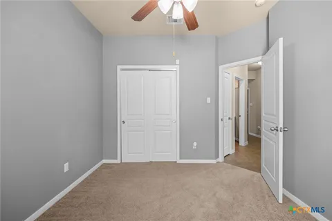 an empty room with a bathroom