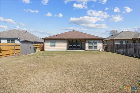 a house with yard in front of it