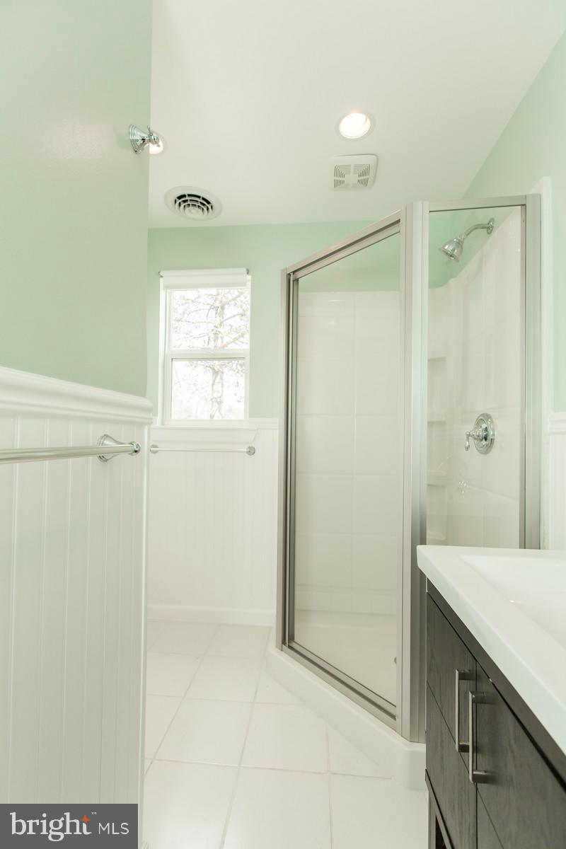 1047 New Hope Road Cross Junction, VA 22625 - Photo 14 of 27 a bathroom with a shower and a sink