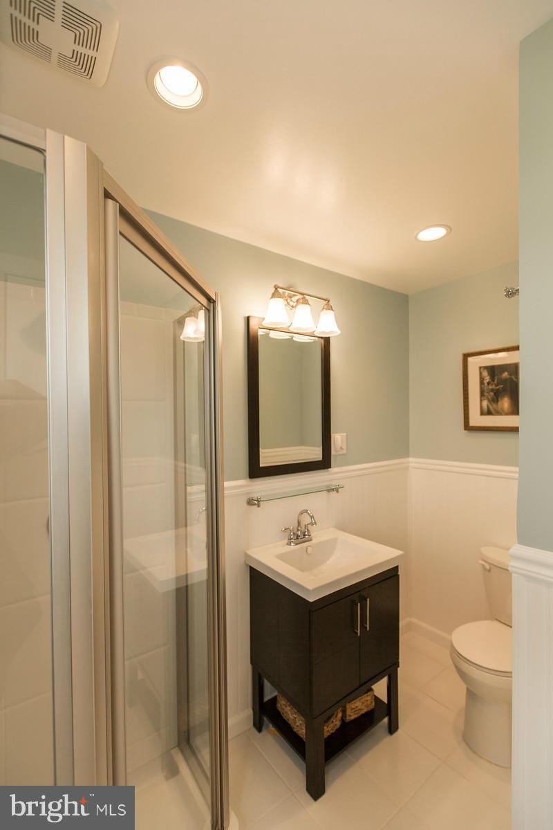 1047 New Hope Road Cross Junction, VA 22625 - Photo 15 of 27 a bathroom with a sink a toilet and mirror