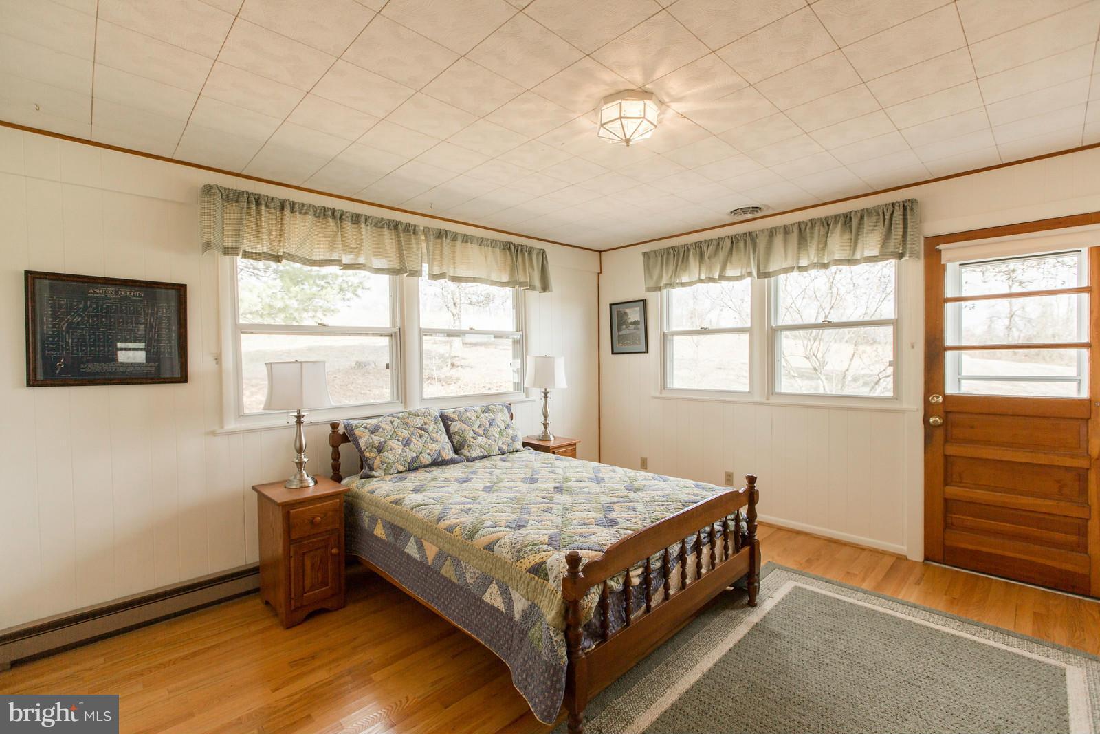 1047 New Hope Road Cross Junction, VA 22625 - Photo 17 of 27 a bedroom with a bed and a window