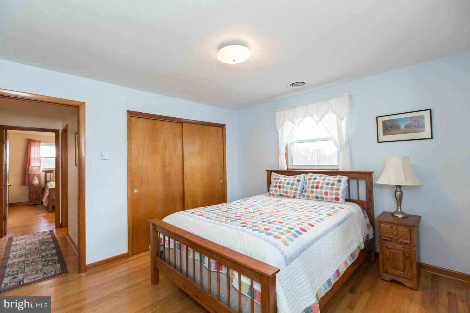 1047 New Hope Road Cross Junction, VA 22625 - Photo 20 of 27 a bedroom that has a bed and a table in it