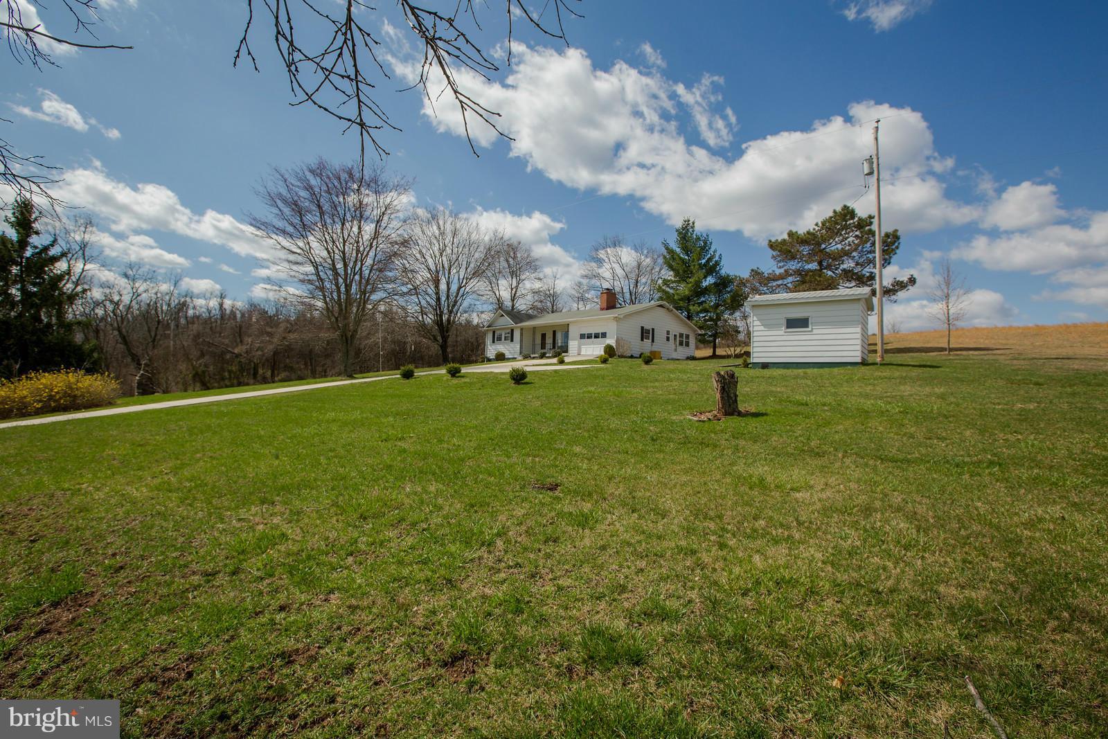 1047 New Hope Road Cross Junction, VA 22625 - Photo 23 of 27 a backyard of a house with lots of green space