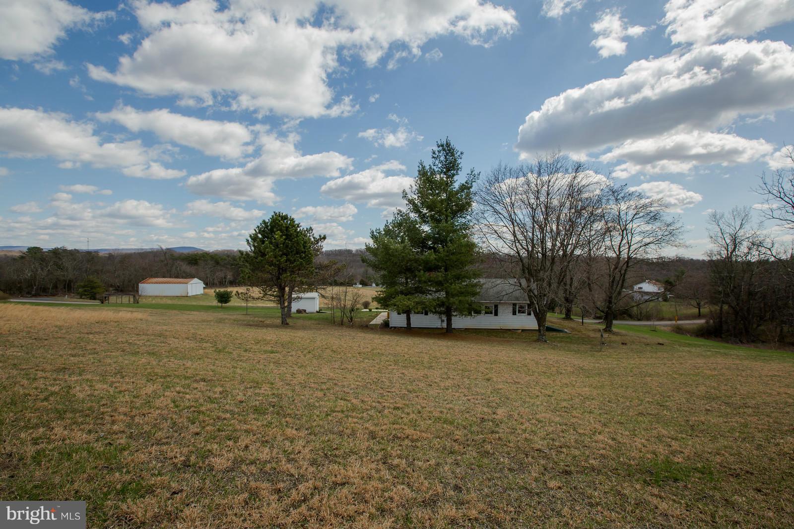 1047 New Hope Road Cross Junction, VA 22625 - Photo 25 of 27 a backyard of a house with lots of green space
