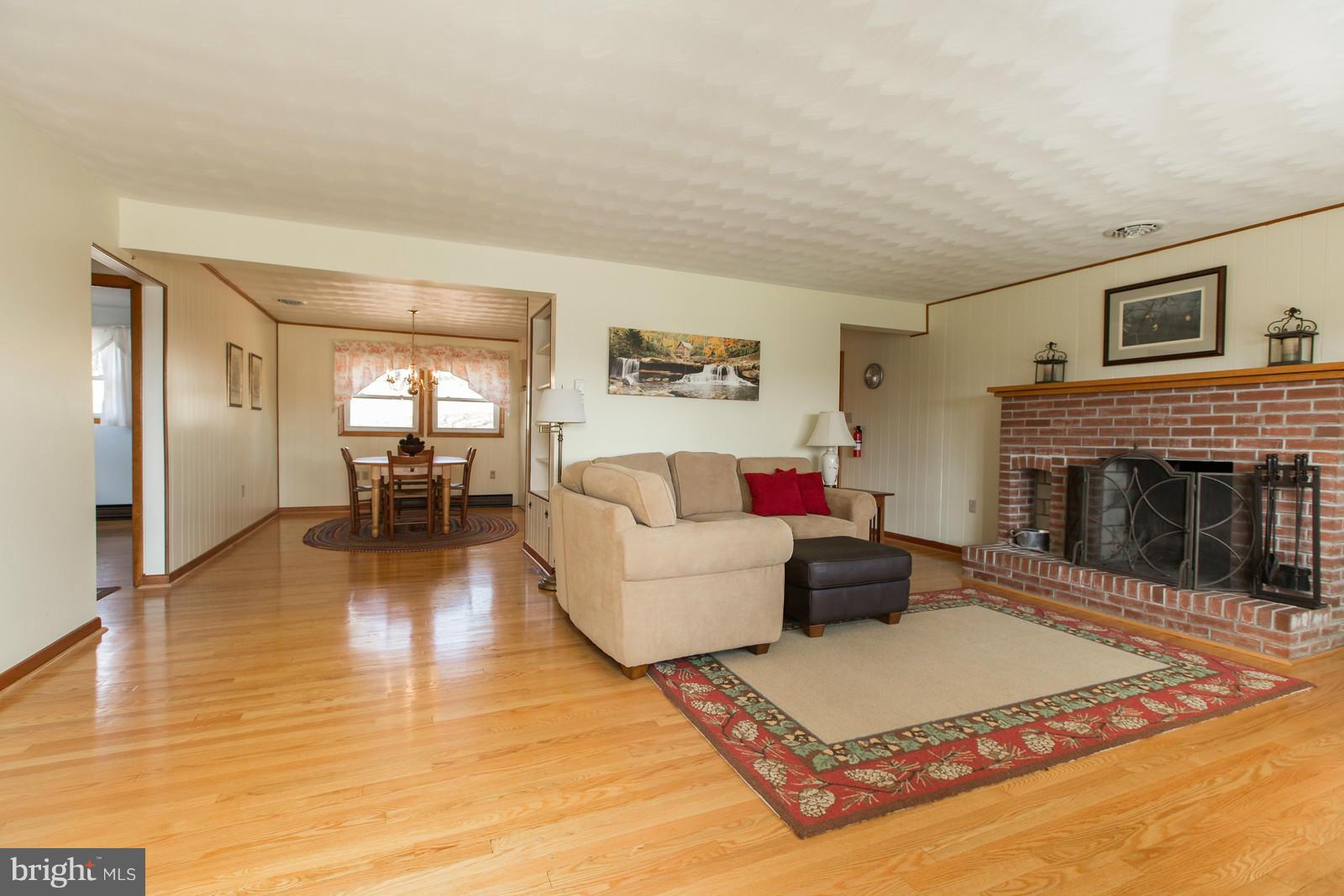 1047 New Hope Road Cross Junction, VA 22625 - Photo 5 of 27 a living room with furniture and a fireplace