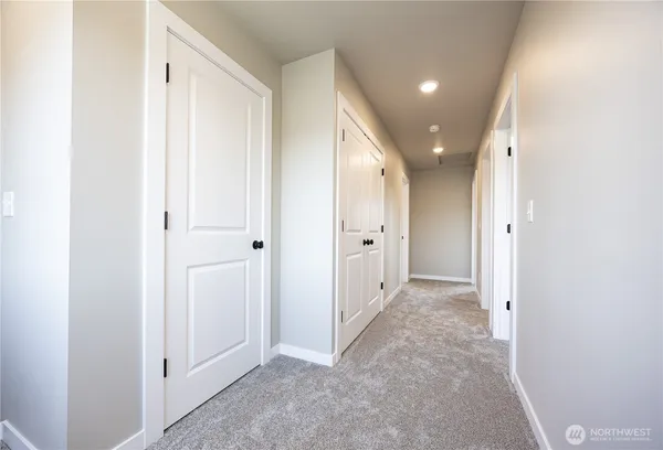 a bedroom with bed and a night stand