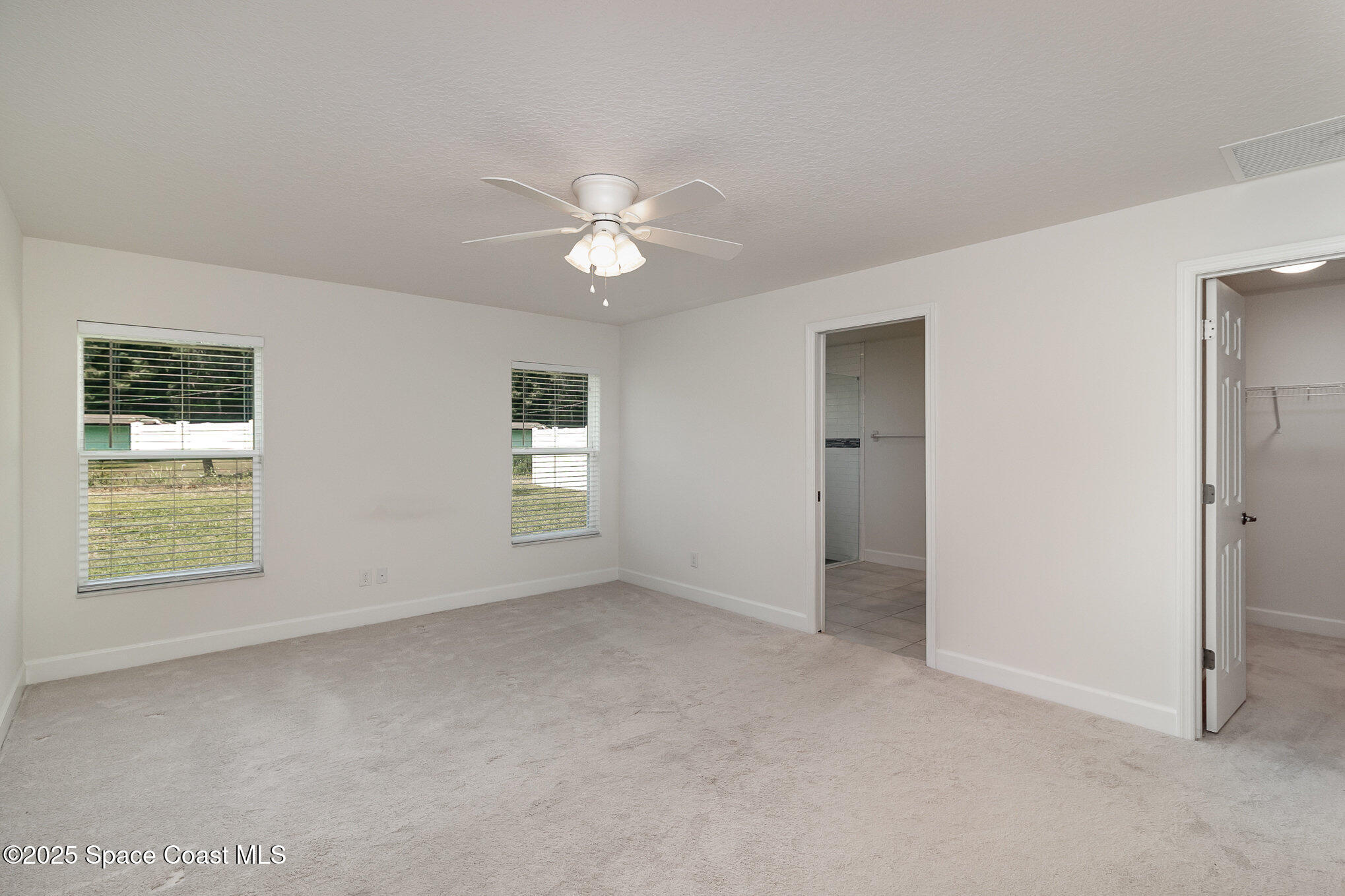 691 Belvedere Road Northwest Palm Bay, FL 32907 - Photo 11 of 26 a view of an empty room with a window