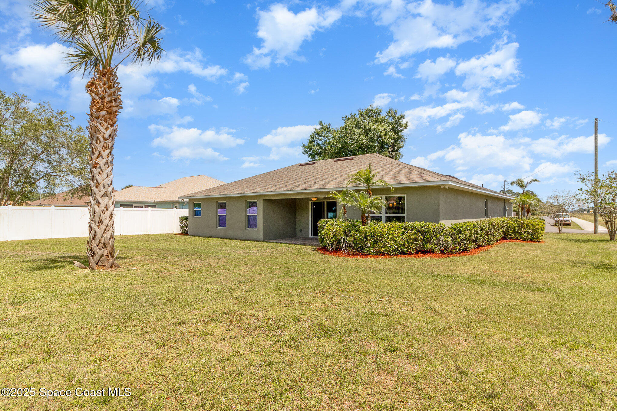 691 Belvedere Road Northwest Palm Bay, FL 32907 - Photo 21 of 26 a front view of house with yard and green space