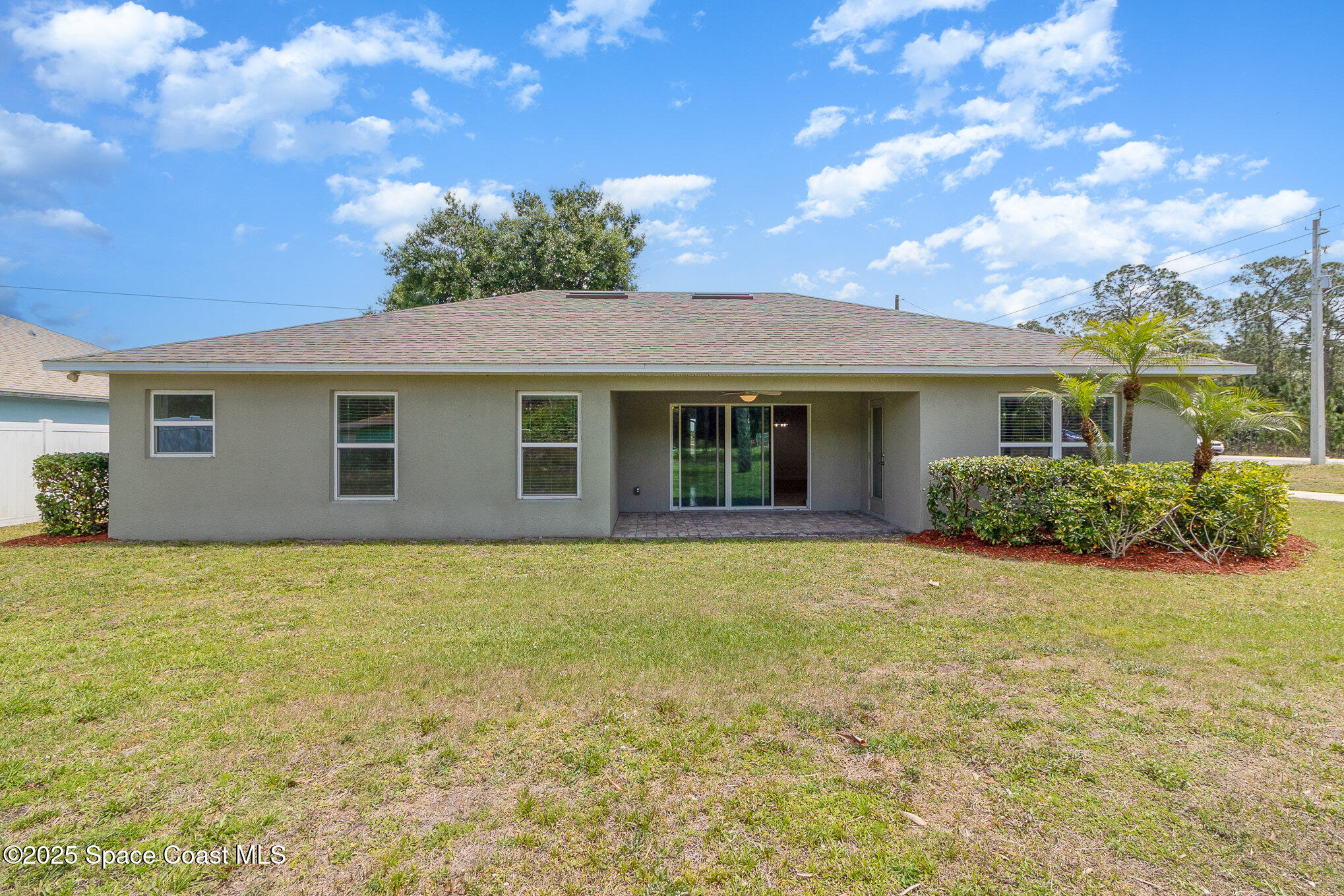 691 Belvedere Road Northwest Palm Bay, FL 32907 - Photo 22 of 26 a view of a house with backyard and garden