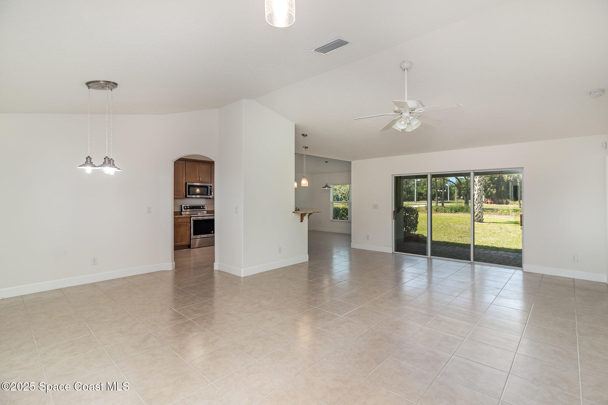 691 Belvedere Road Northwest Palm Bay, FL 32907 - Photo 5 of 26 a view of an empty room with a window