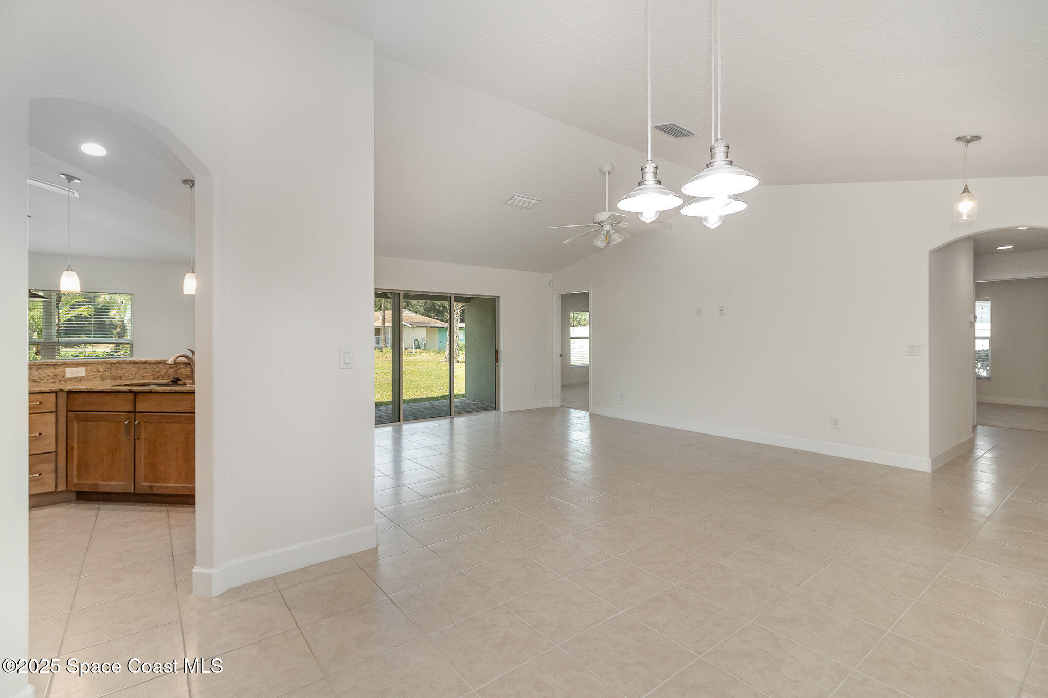 691 Belvedere Road Northwest Palm Bay, FL 32907 - Photo 10 of 26 a view of a kitchen with a dishwasher cabinets and a kitchen