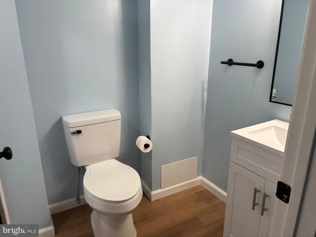 a bathroom with a toilet and a sink