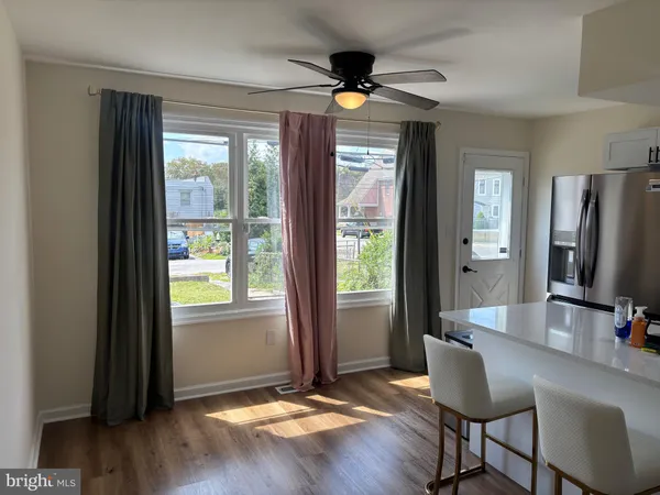 a view of a livingroom with furniture and a window