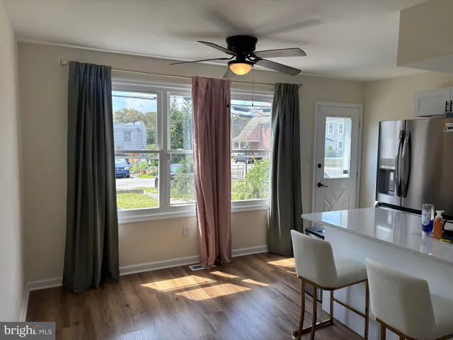 a view of a livingroom with furniture and a window