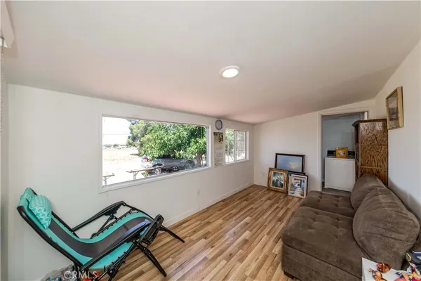 a bedroom with furniture and a window