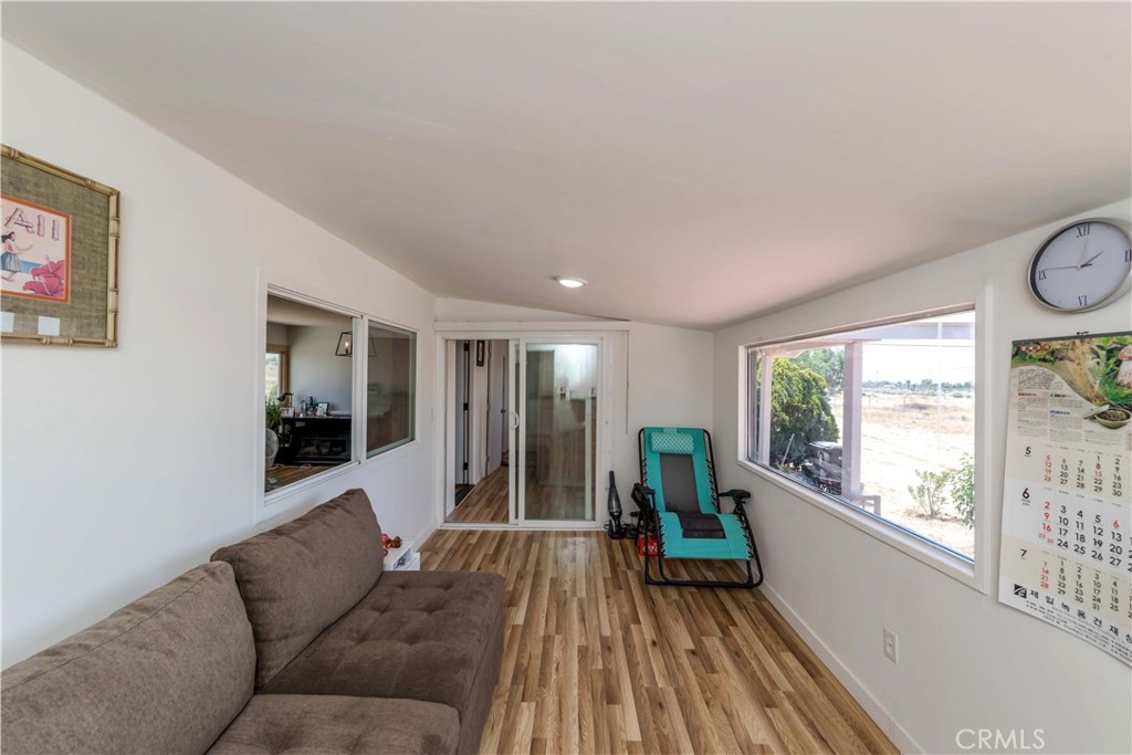 7127 Phelan Road Phelan, CA 92371 - Photo 18 of 44 a living room with furniture and a large window