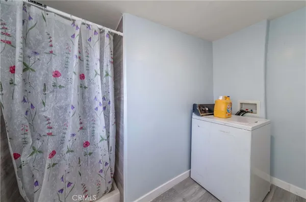 a bathroom with a shower curtain and a sink