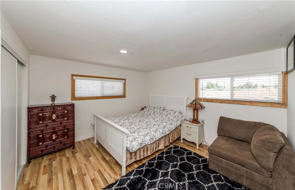 7127 Phelan Road Phelan, CA 92371 - Photo 29 of 44 a living room with furniture and a flat screen tv