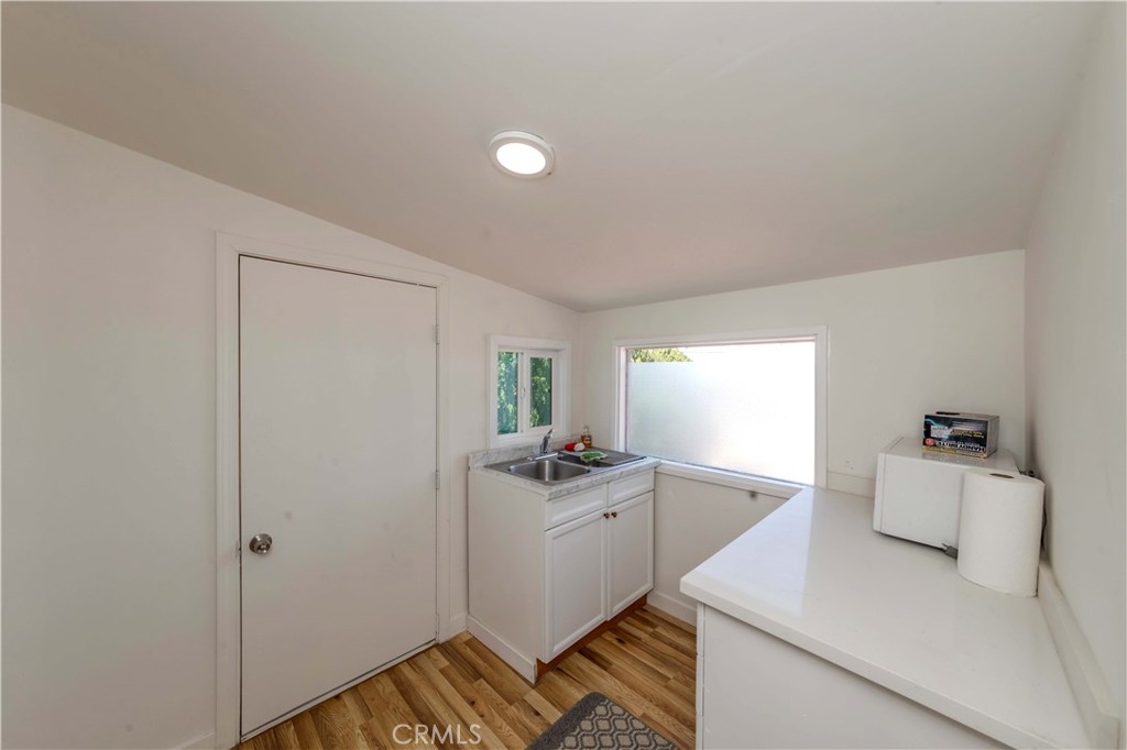 7127 Phelan Road Phelan, CA 92371 - Photo 33 of 44 a kitchen with a sink cabinets and window