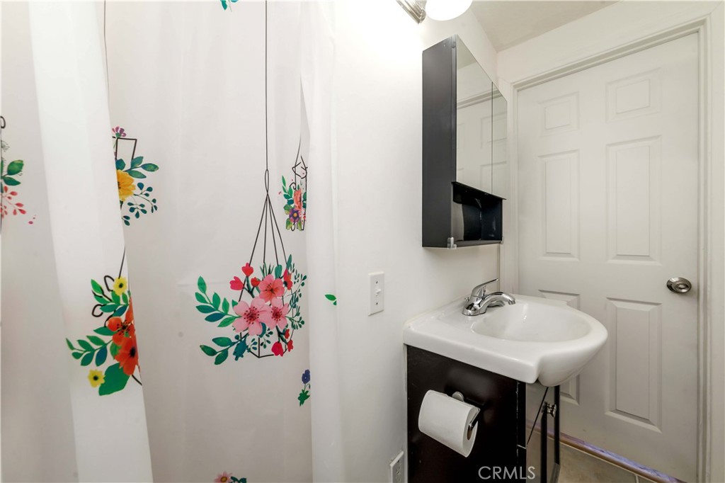 7127 Phelan Road Phelan, CA 92371 - Photo 37 of 44 a bathroom with a sink mirror and vanity