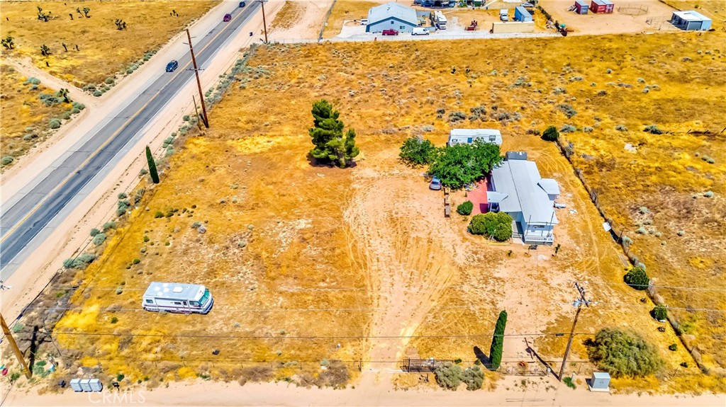 7127 Phelan Road Phelan, CA 92371 - Photo 5 of 44 a view of a balcony with wooden floor and city view