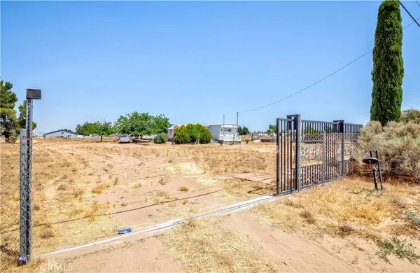 a view of a backyard of the house