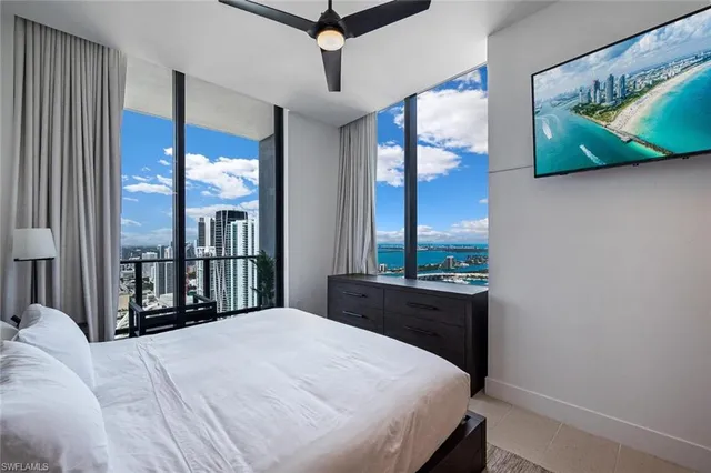 a room with walk in closet and wooden floor