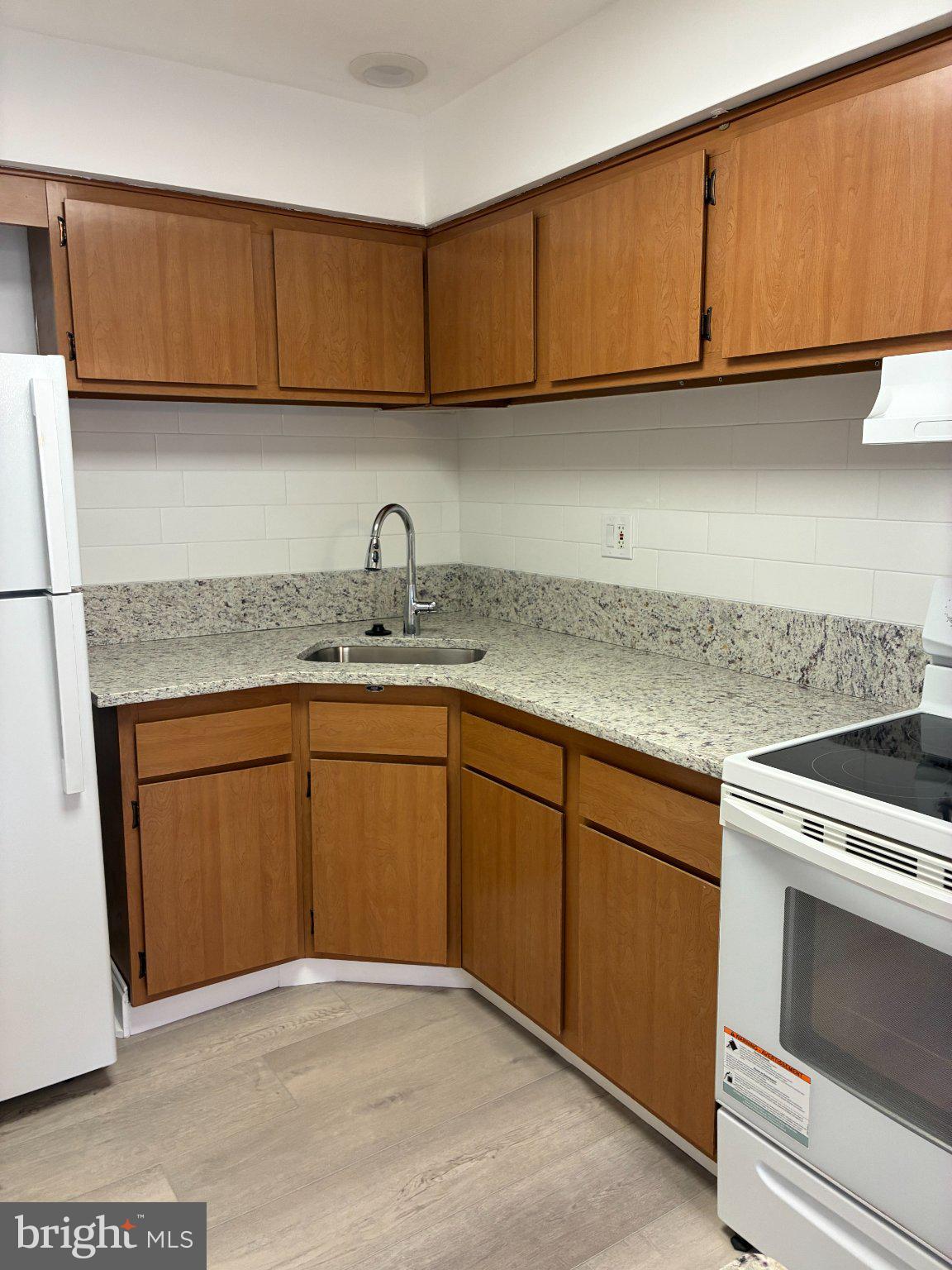 512 Stidman Drive, Unit D4 Springfield, PA 19064 - Photo 9 of 14 Modern kitchen with sleek finishes.