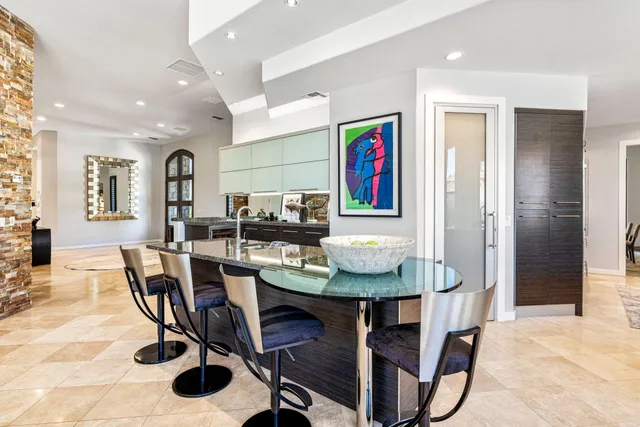 a utility room with stainless steel appliances and a sink