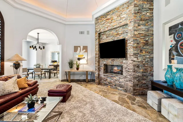 a spacious bathroom with a granite countertop sink and a mirror
