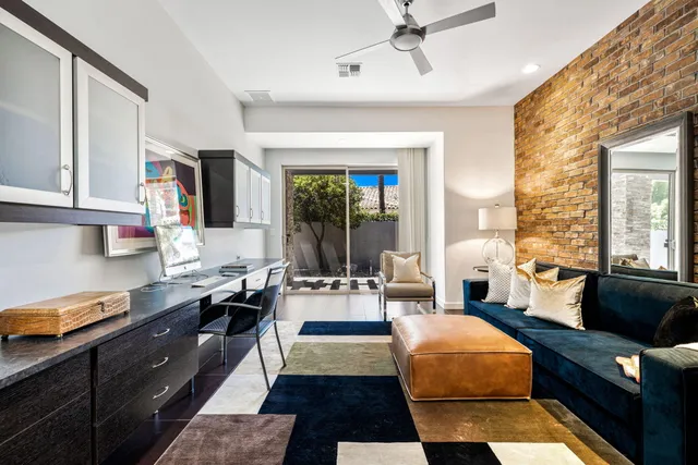 a view of a house with pool and chairs