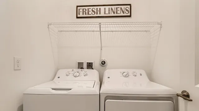 a utility room with dryer and washer