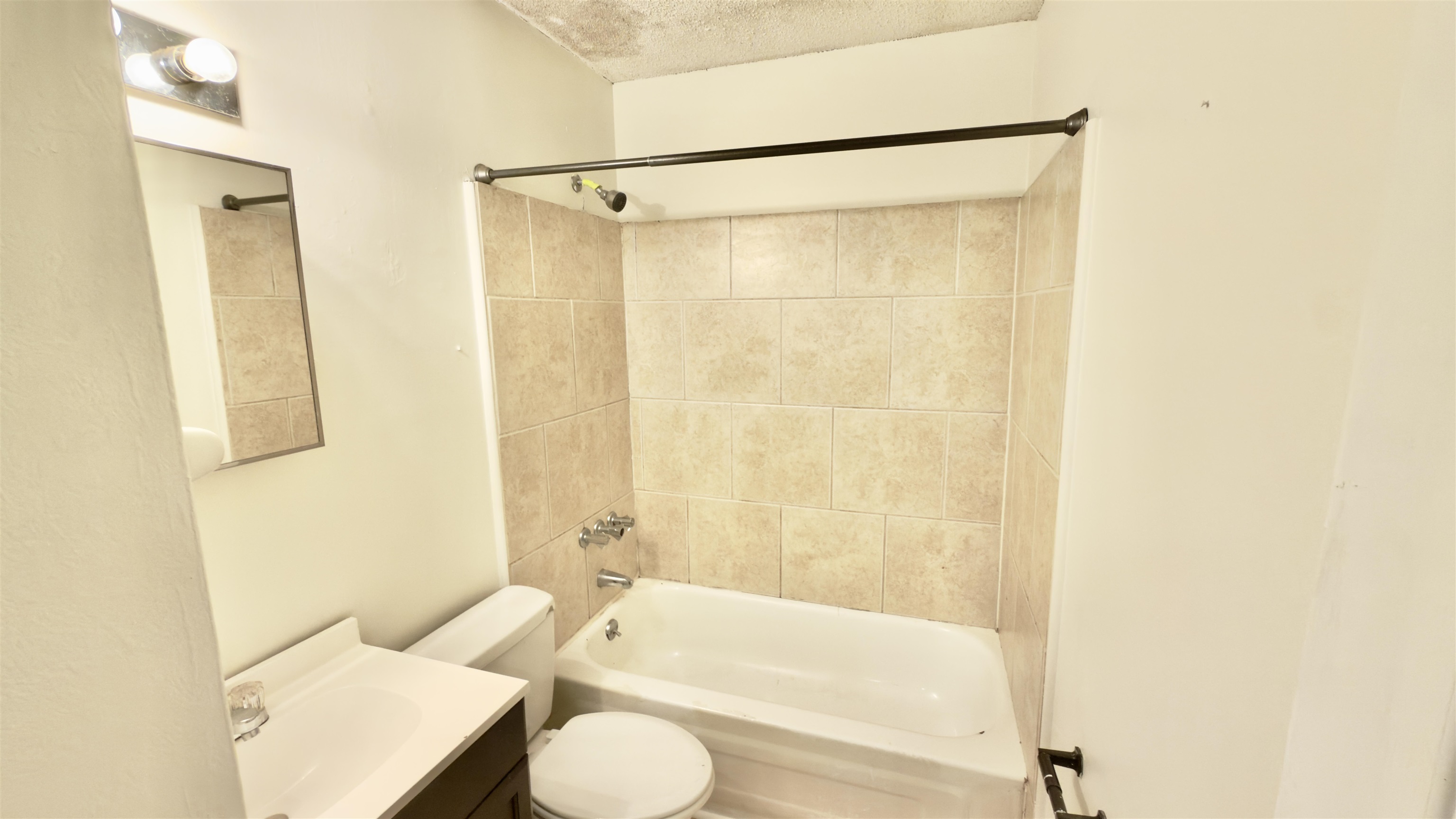 3799 Carnes Avenue Memphis, TN 38111 - Photo 5 of 16 a bathroom with a shower curtain and a sink