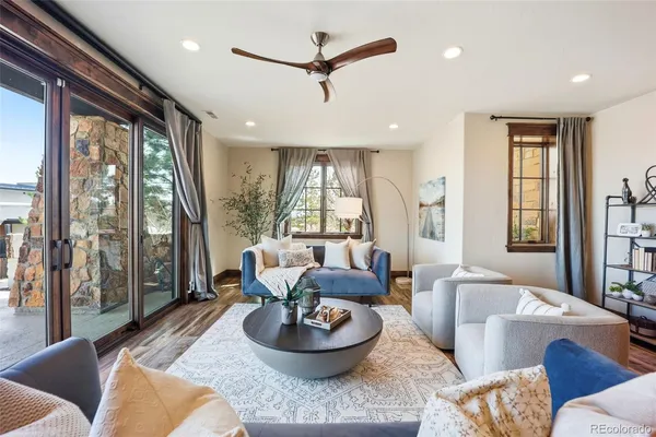 a living room with furniture and a large window