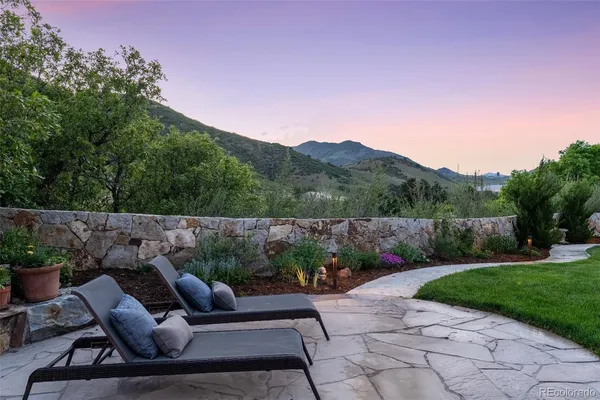 a view of house with backyard sitting area