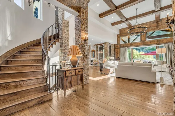 a view of entryway and hall with wooden floor