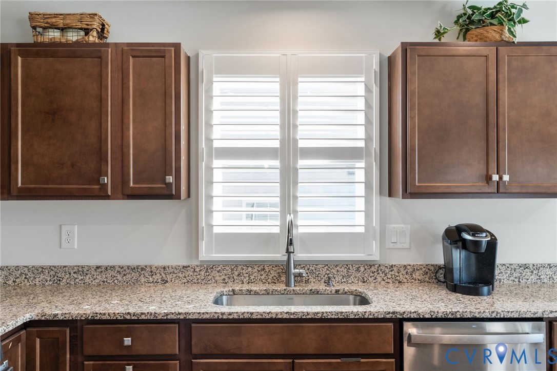 7735 Medalist Lane New Kent, VA 23124 - Photo 11 of 47 Kitchen with dishwasher, light stone counters, and