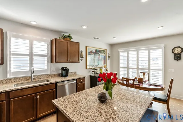a bathroom with a double vanity sink toilet and shower