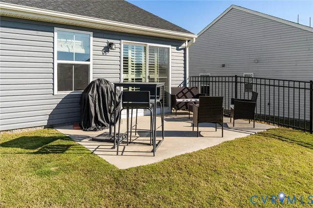 a view of house with garden and entertaining space
