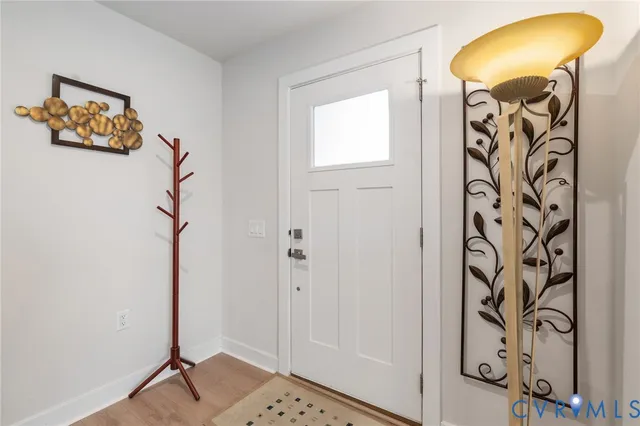 a view of a hallway with paintings on the wall