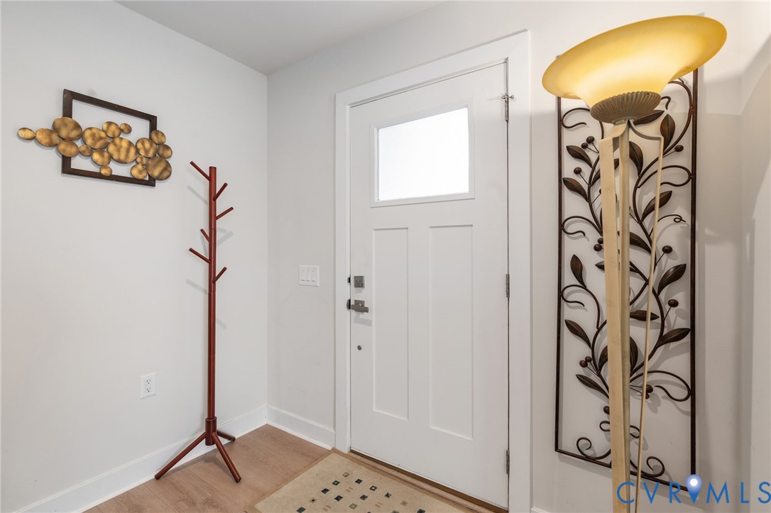 7735 Medalist Lane New Kent, VA 23124 - Photo 4 of 47 Entryway with baseboards and wood finished floors