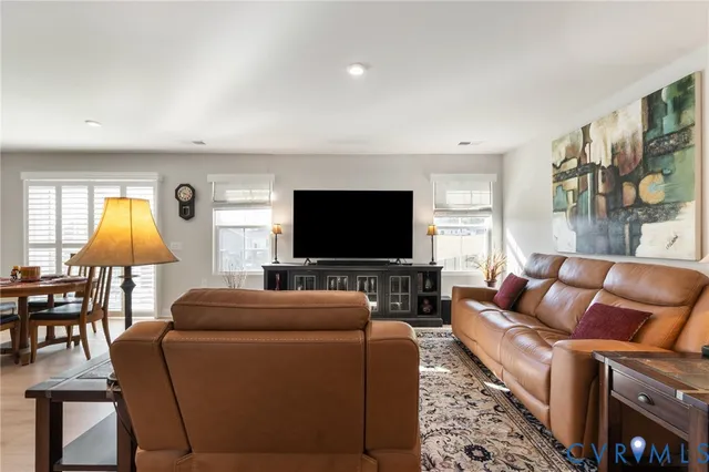 a kitchen with stainless steel appliances granite countertop a sink refrigerator and microwave