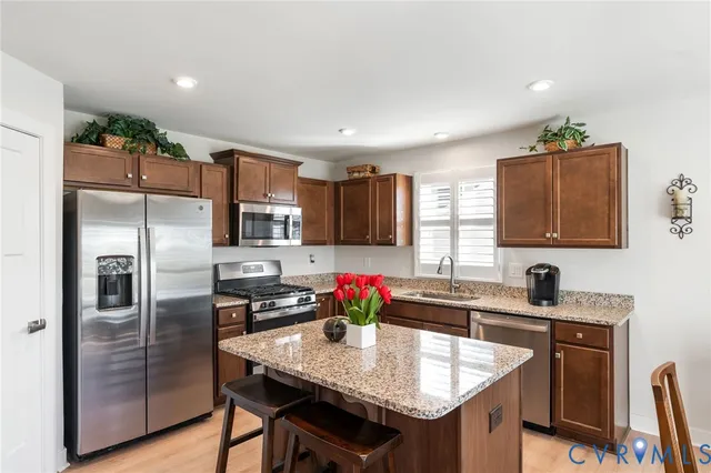 a kitchen with a table and chairs in it